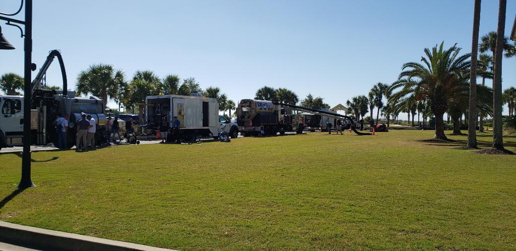 outside Jekyll Island Convention Center, trucks from vendors at the event are lined up with people looking at them